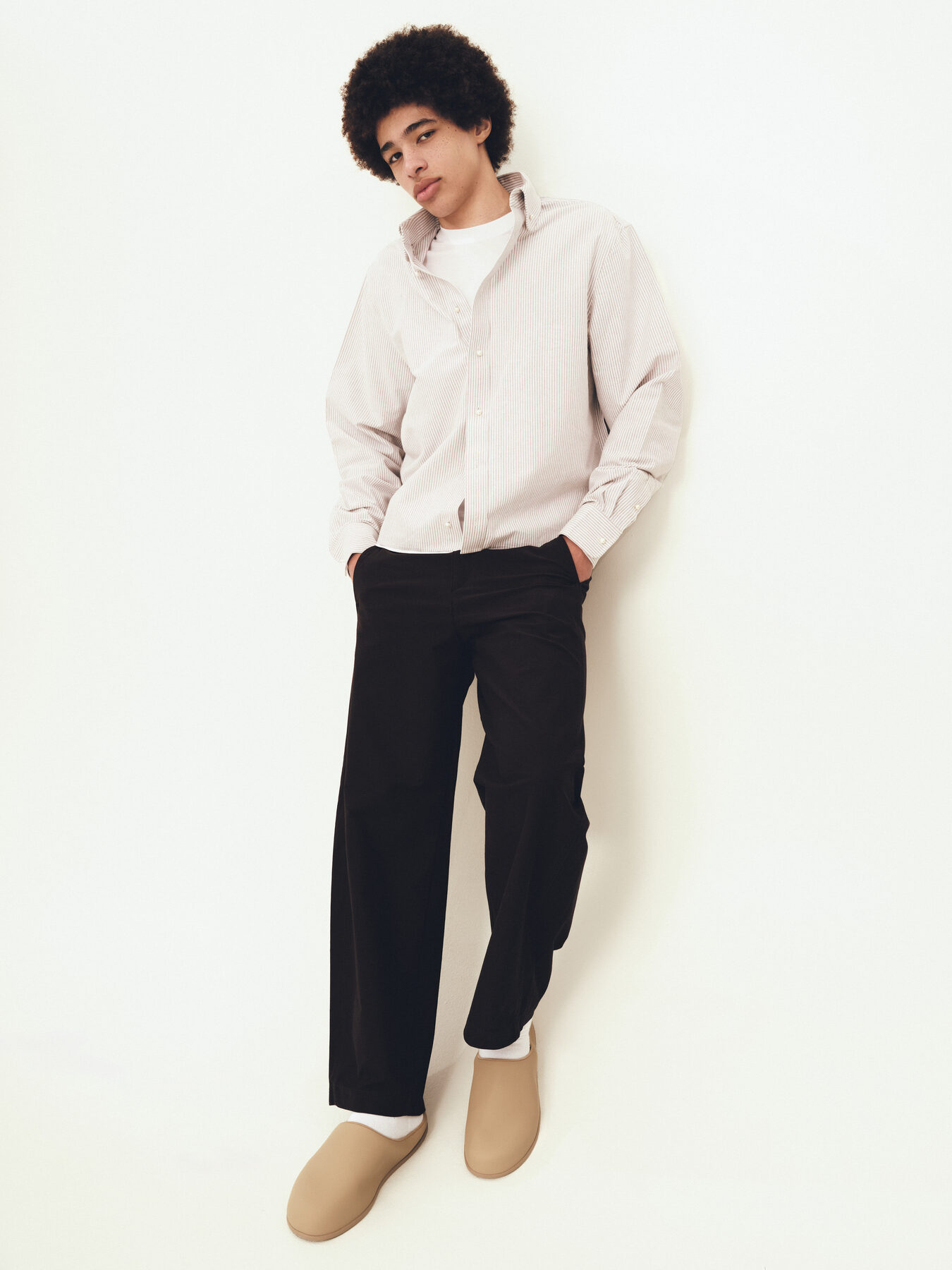 Editorial menswear portrait, seated, minimal styling