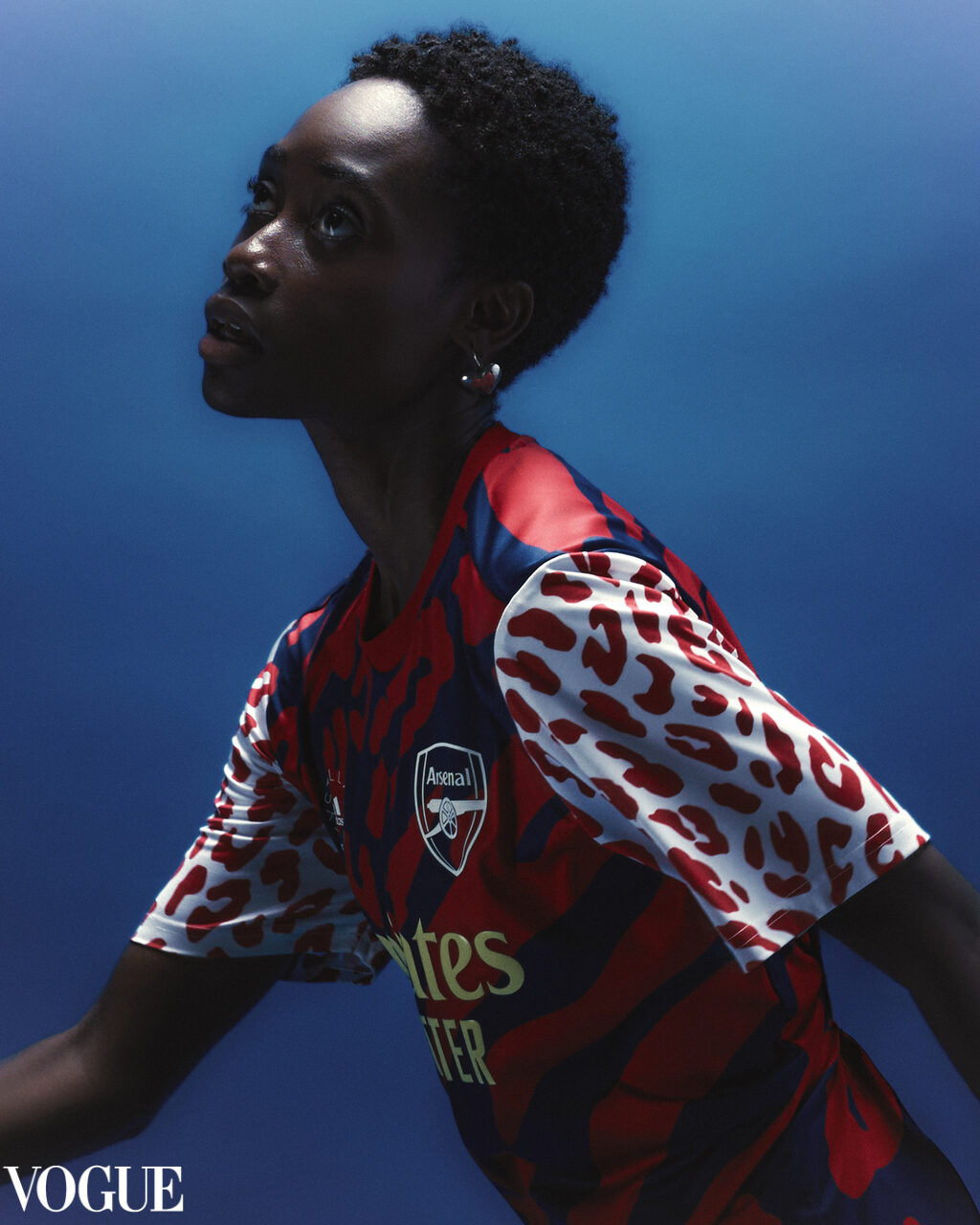 Athlete in an Arsenal x adidas kit against a deep blue gradient — featured on PhotoVogue