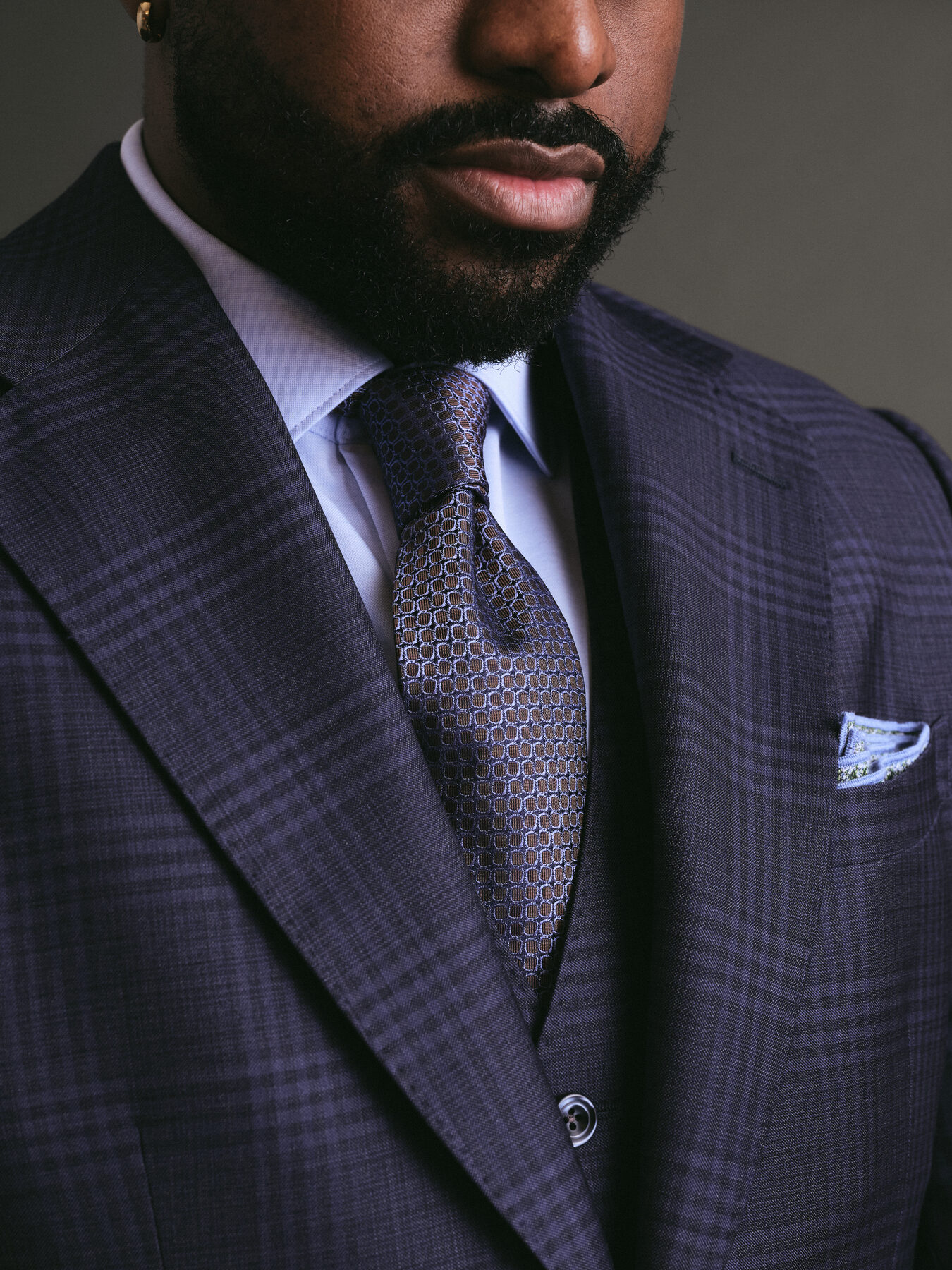 Portrait of a man in a tailored suit, cinematic afternoon light
