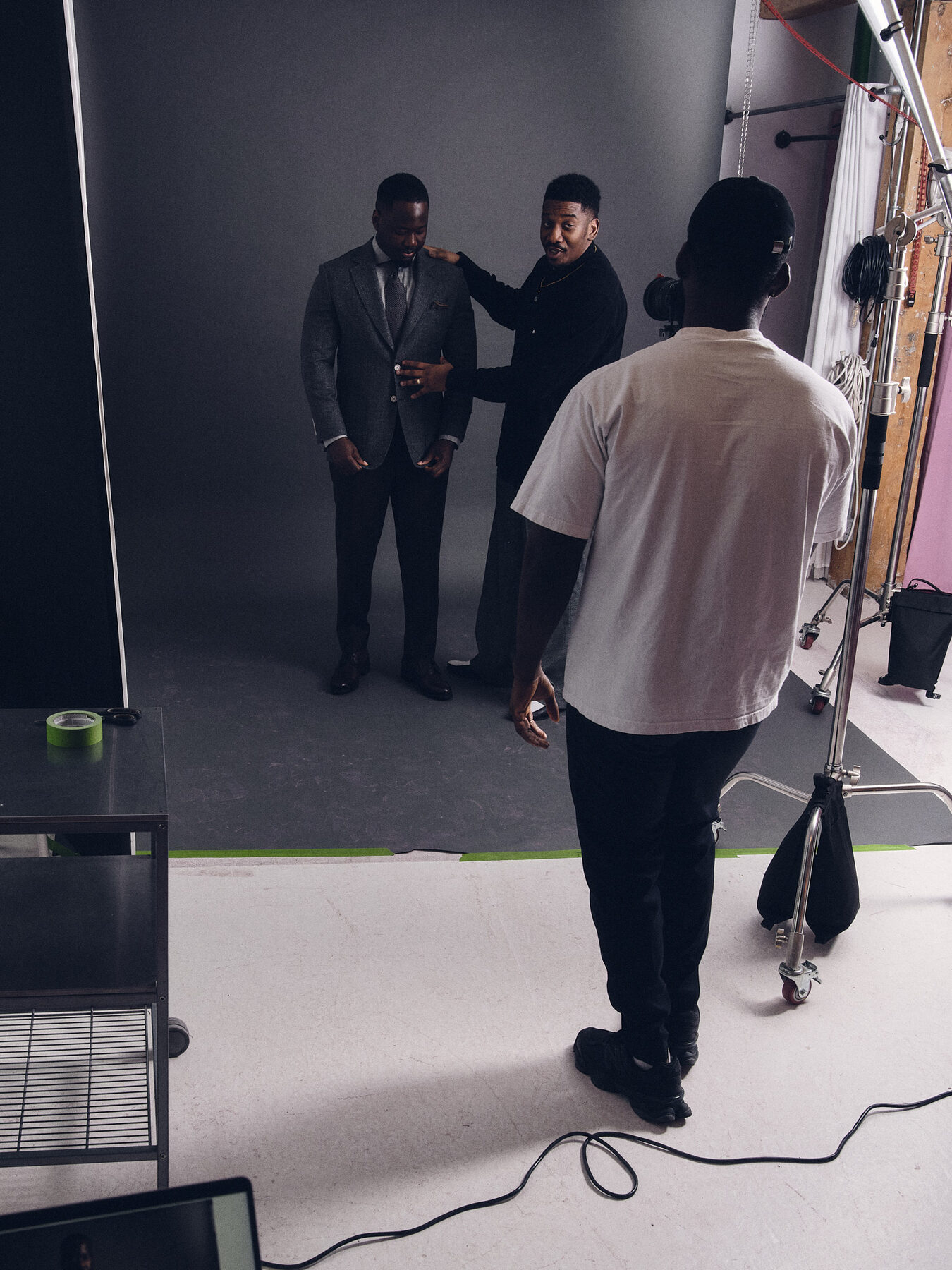 Behind the scenes — crew and photographer on a studio set